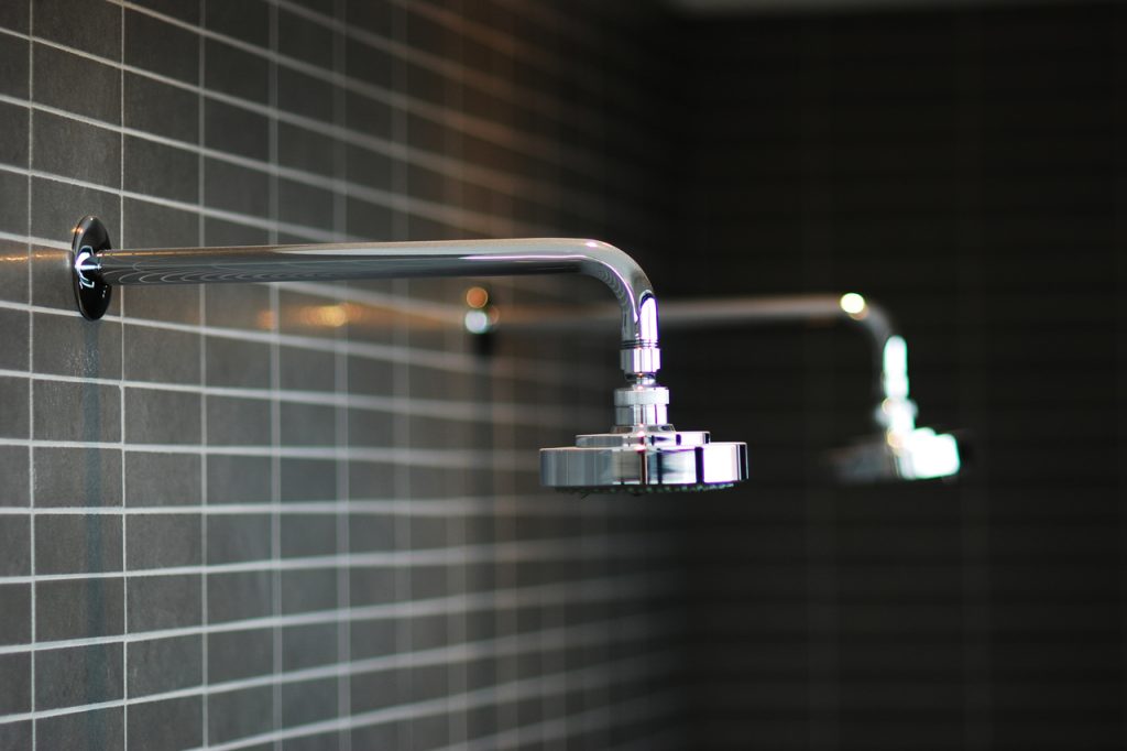 Custom shower hardware in a condominium renovation Formlinea Design Build, Chicago IL